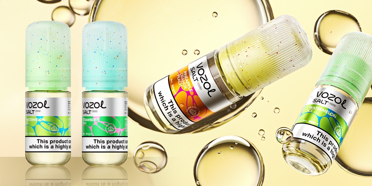 E-liquide Vozol Salt Orange-Pêche 20 mg, flacon contenant un liquide jaune sur fond de bulles d'huile